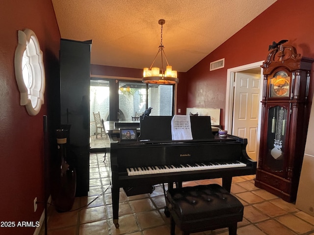 15240 N 51st St, Scottsdale, AZ 85254 - sitting room with a textured ceiling, visible vents, vaulted ceiling, and a chandelier