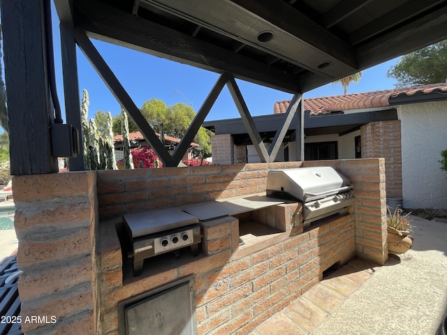 15240 N 51st St, Scottsdale, AZ 85254 - view of patio / terrace with grilling area and an outdoor kitchen