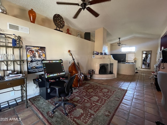 15240 N 51st St, Scottsdale, AZ 85254 - office space featuring tile patterned flooring, ceiling fan, a fireplace with raised hearth, visible vents, and lofted ceiling