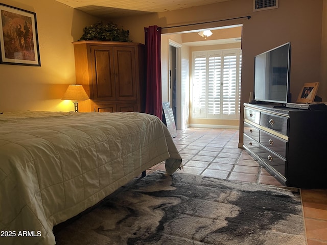 15240 N 51st St, Scottsdale, AZ 85254 - bedroom featuring light tile patterned flooring and visible vents