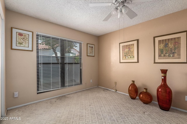 15240 N 51st St, Scottsdale, AZ 85254 - spare room featuring a textured ceiling, ceiling fan, carpet floors, and baseboards