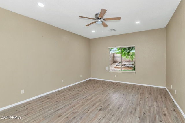 unfurnished room featuring ceiling fan and light hardwood / wood-style flooring