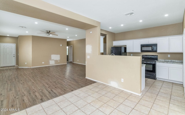 kitchen with white cabinetry, ceiling fan, black appliances, and light tile floors