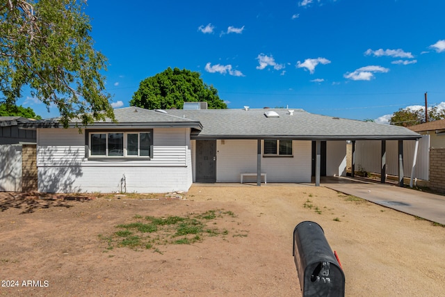 single story home with a carport