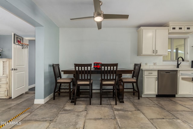 dining area featuring ceiling fan and sink