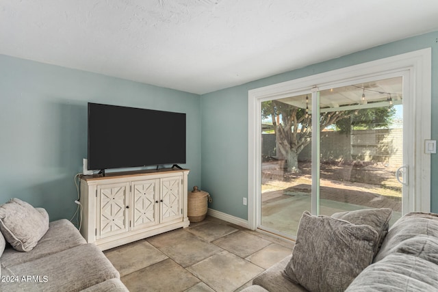 living room with a textured ceiling and plenty of natural light