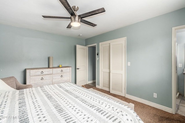 bedroom with a closet, ceiling fan, and light colored carpet