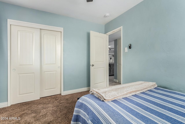 carpeted bedroom with a closet