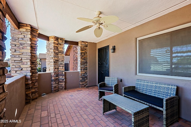 view of patio featuring ceiling fan