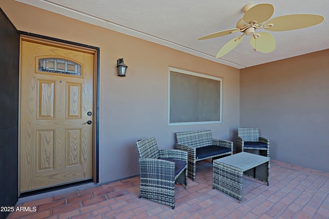 entrance to property with a patio and an outdoor living space