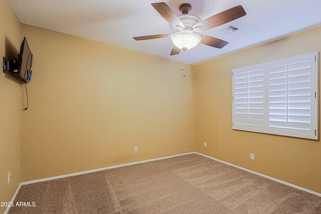 carpeted empty room with ceiling fan