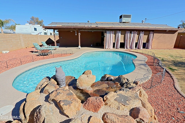 view of pool featuring a patio area and cooling unit