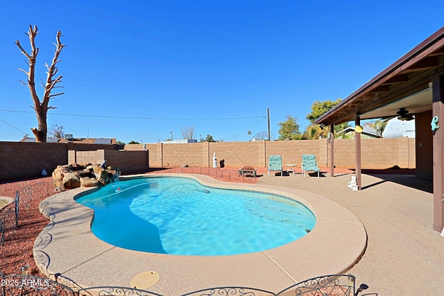 view of pool featuring ceiling fan, a patio, and pool water feature