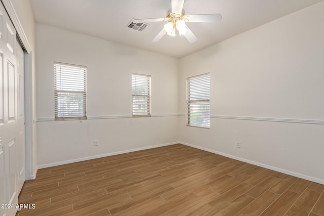 spare room featuring ceiling fan and hardwood / wood-style floors