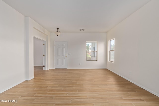 empty room with light wood-type flooring