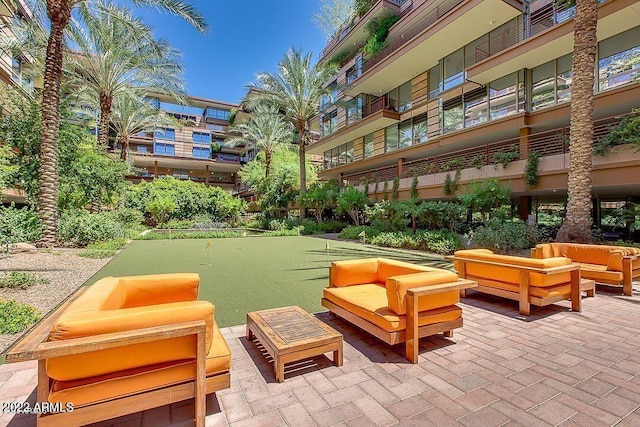 exterior space with an outdoor hangout area and a patio area