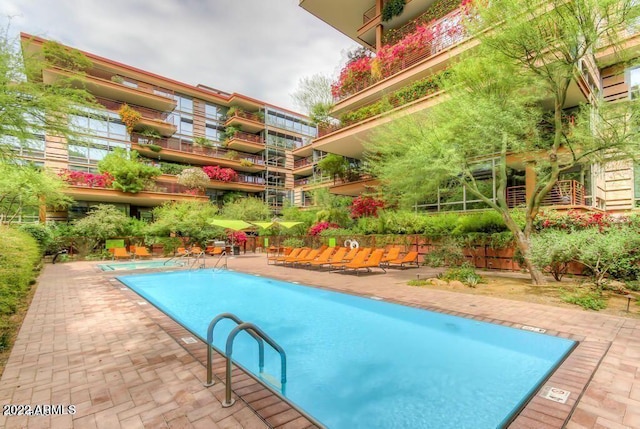 community pool featuring a patio area