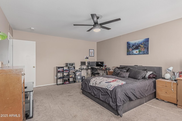 carpeted bedroom with a ceiling fan and baseboards
