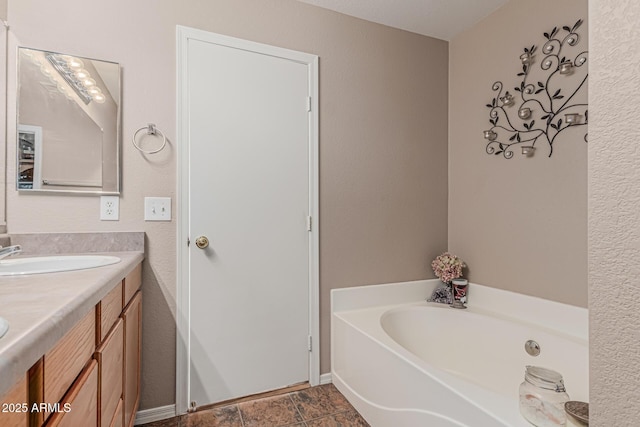 bathroom featuring a bath and double vanity