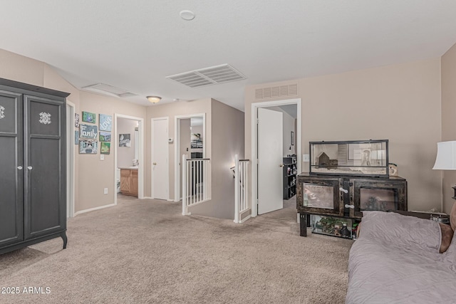living area with light colored carpet and baseboards
