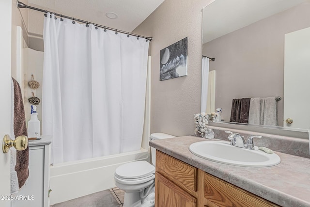 full bath featuring toilet, shower / bath combination with curtain, vanity, tile patterned flooring, and a textured wall
