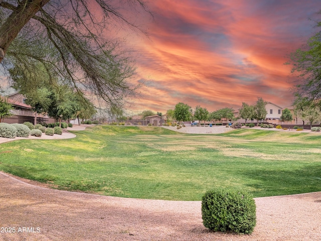 view of property's community with a lawn