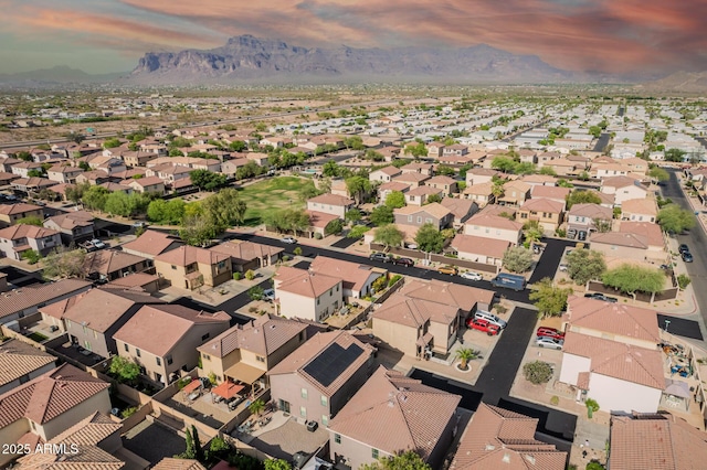 aerial view at dusk of a mountain view and a residential view