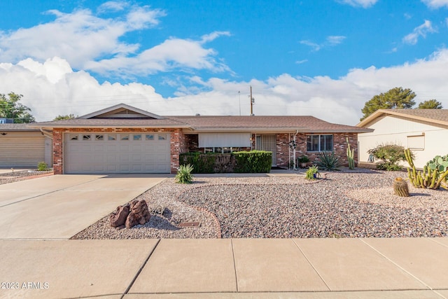 ranch-style home featuring a garage