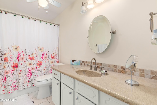 bathroom featuring vanity, tile patterned floors, a shower with shower curtain, ceiling fan, and toilet