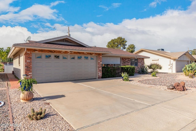 ranch-style home featuring a garage