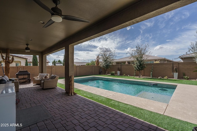 view of pool with a ceiling fan, a patio area, a fenced in pool, and a fenced backyard