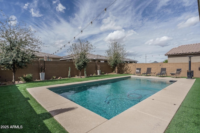 view of pool featuring a patio area, a fenced backyard, a fenced in pool, and a lawn