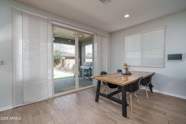 dining space with visible vents, recessed lighting, baseboards, and wood finished floors