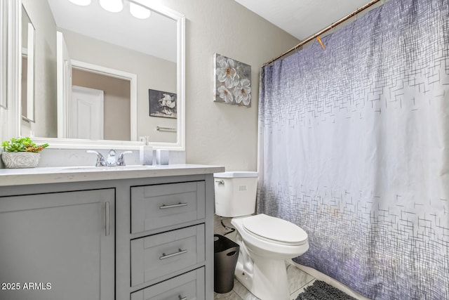 full bathroom featuring toilet, vanity, and a shower with curtain