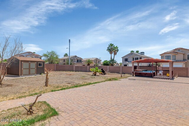 view of brick / pavers driveway with a residential view