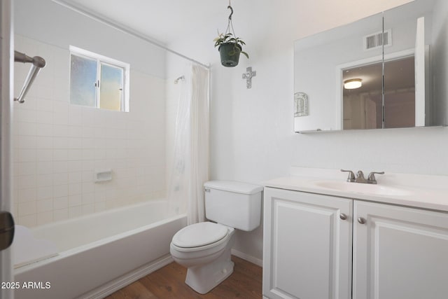 full bathroom with hardwood / wood-style floors, vanity, toilet, and shower / bath combination with curtain