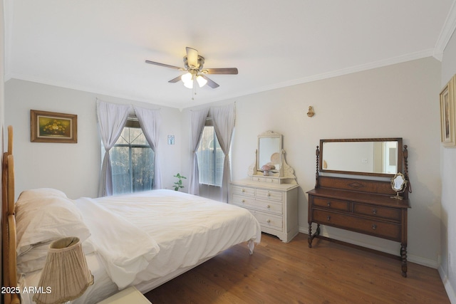 bedroom with ceiling fan, crown molding, and hardwood / wood-style flooring