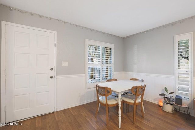 dining area with dark hardwood / wood-style flooring