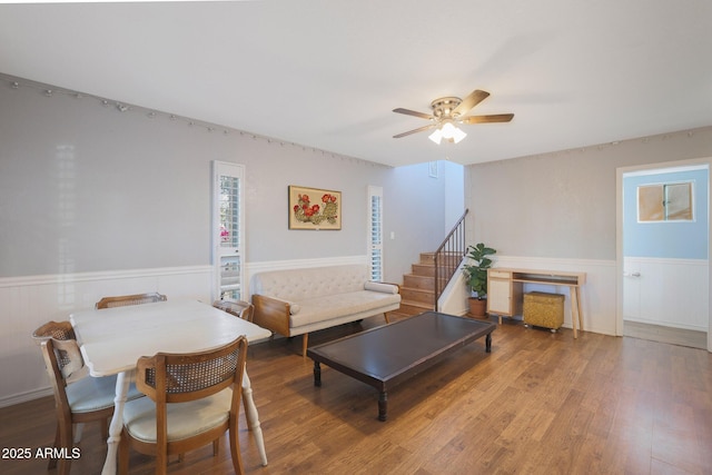 living room featuring ceiling fan and hardwood / wood-style floors