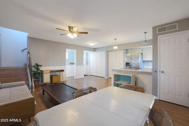 dining room featuring hardwood / wood-style floors and ceiling fan