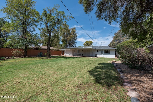 view of yard featuring a fenced backyard