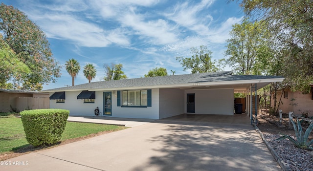 single story home with an attached carport and concrete driveway