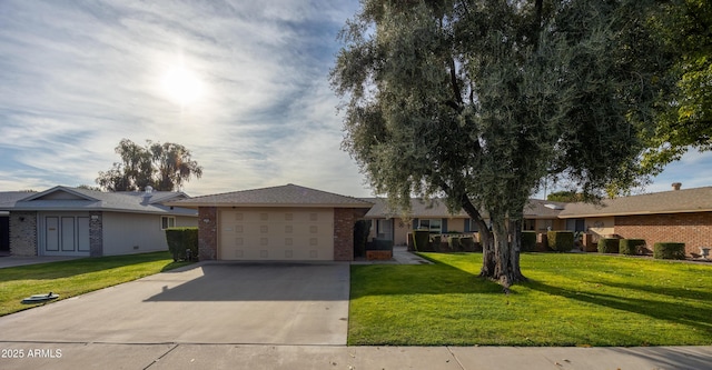 ranch-style house featuring a front yard and a garage