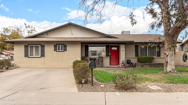 ranch-style home with a front yard