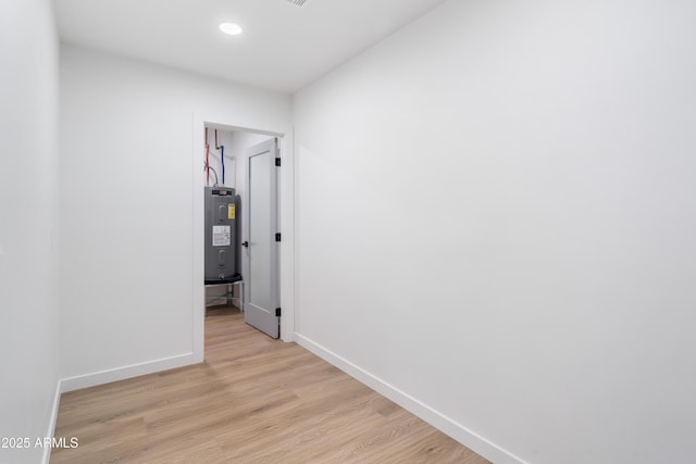 hall featuring water heater and light wood-type flooring