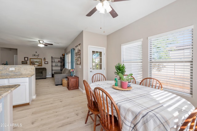 dining room featuring ceiling fan and light hardwood / wood-style floors