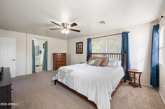 bedroom featuring ceiling fan and light carpet