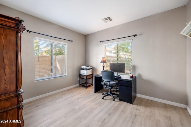 office space with light hardwood / wood-style flooring