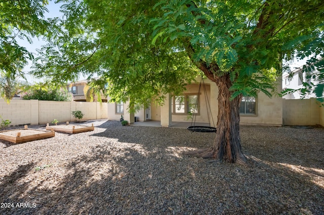 rear view of house with a patio area