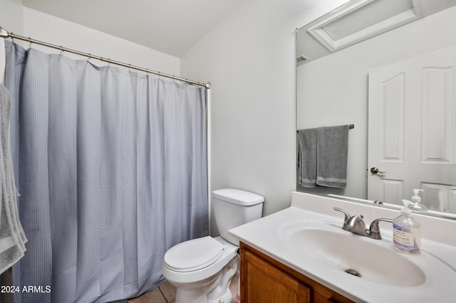 bathroom with toilet, vanity, tile patterned floors, and a shower with shower curtain